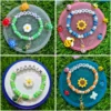 Personalized kids name bracelet with turtle charms and daisy - handmade by The Beading Sisters