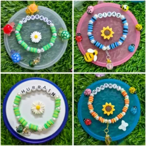 Personalized kids name bracelet with turtle charms and daisy - handmade by The Beading Sisters