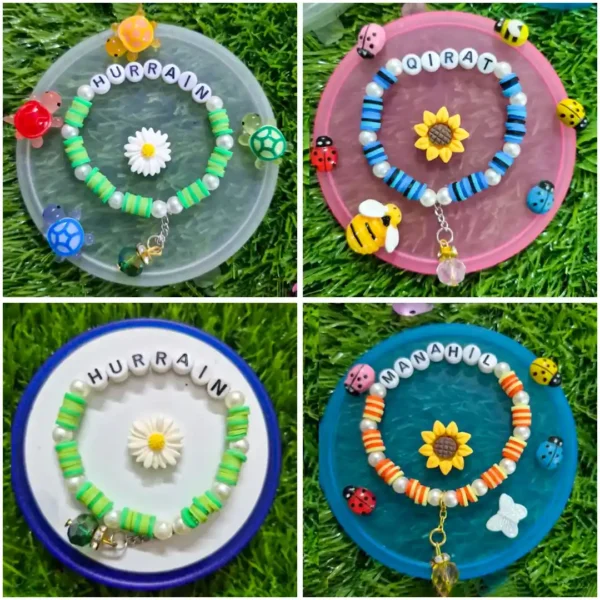 Personalized kids name bracelet with turtle charms and daisy - handmade by The Beading Sisters