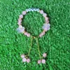 Pink handmade personalized name bracelet with flower beads and charm