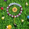 Colorful personalized name beaded bracelet with bee and snail theme