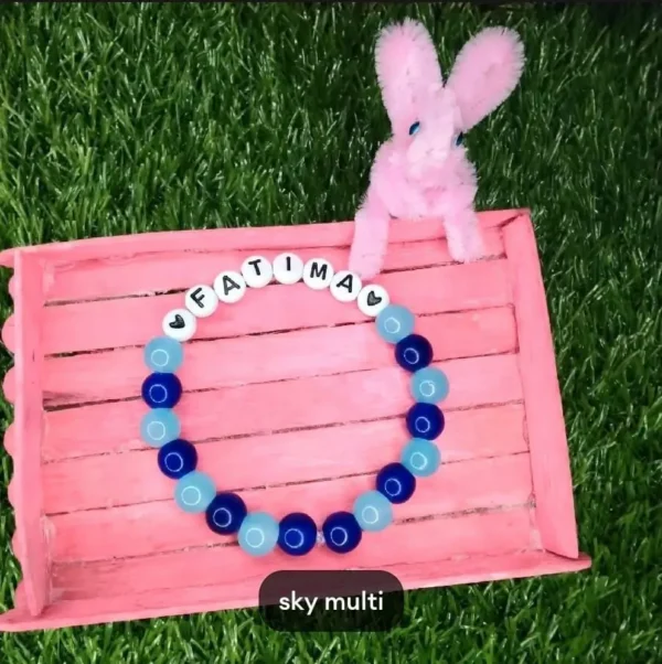 Personalized Easter Name Bracelet with colorful beads and bunny charm handmade by The Beading Sisters