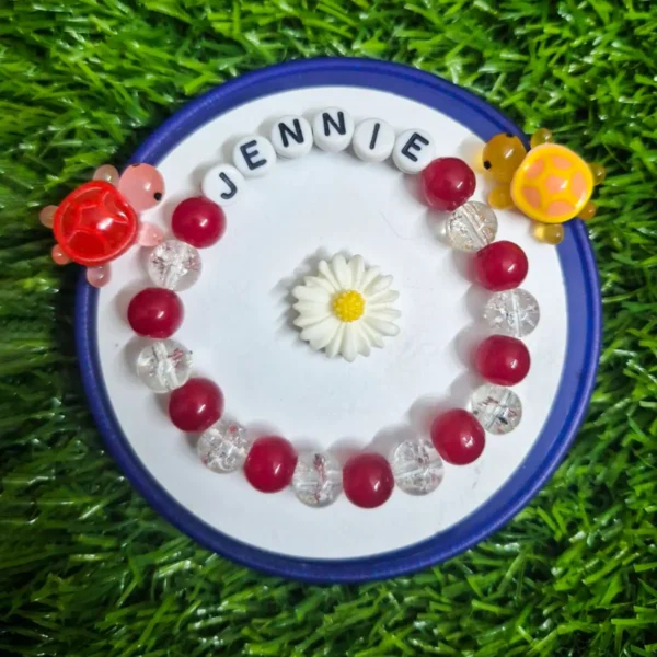 Red custom name friendship bracelet handmade by The Beading Sisters