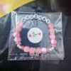 Personalized Luxe Pink Bracelet with custom names in thank you packaging