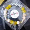 Personalized yellow Luxe Bracelet with custom names in thank you packaging