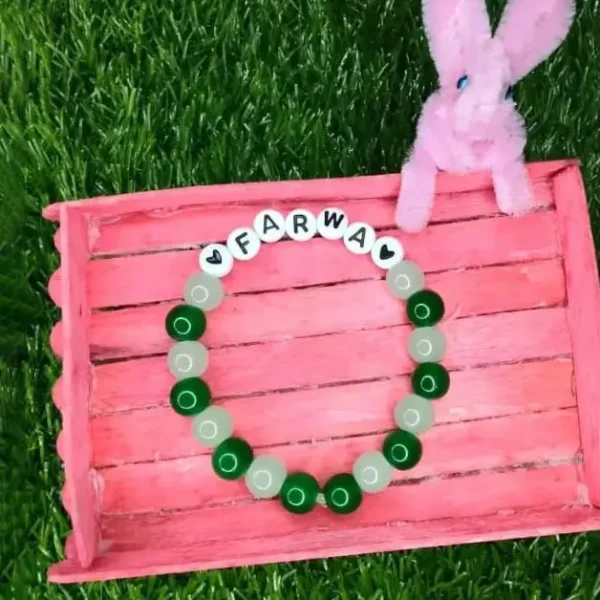 Personalized Easter Name Bracelet with colorful beads and bunny charm handmade by The Beading Sisters