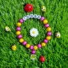 Handmade kids name bracelet with sunflower charm and crystal pendant