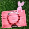 Personalized Easter Name Bracelet with colorful beads and bunny charm handmade by The Beading Sisters