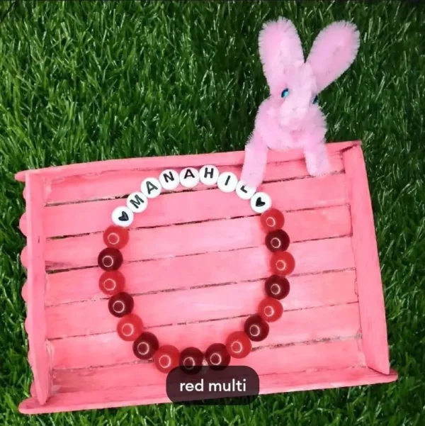 Personalized Easter Name Bracelet with colorful beads and bunny charm handmade by The Beading Sisters