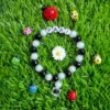 Custom name bracelet with ladybug and daisy charm - personalized kids jewelry