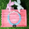 Personalized Easter Name Bracelet with colorful beads and bunny charm handmade by The Beading Sisters