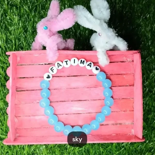 Personalized Easter Name Bracelet with colorful beads and bunny charm handmade by The Beading Sisters